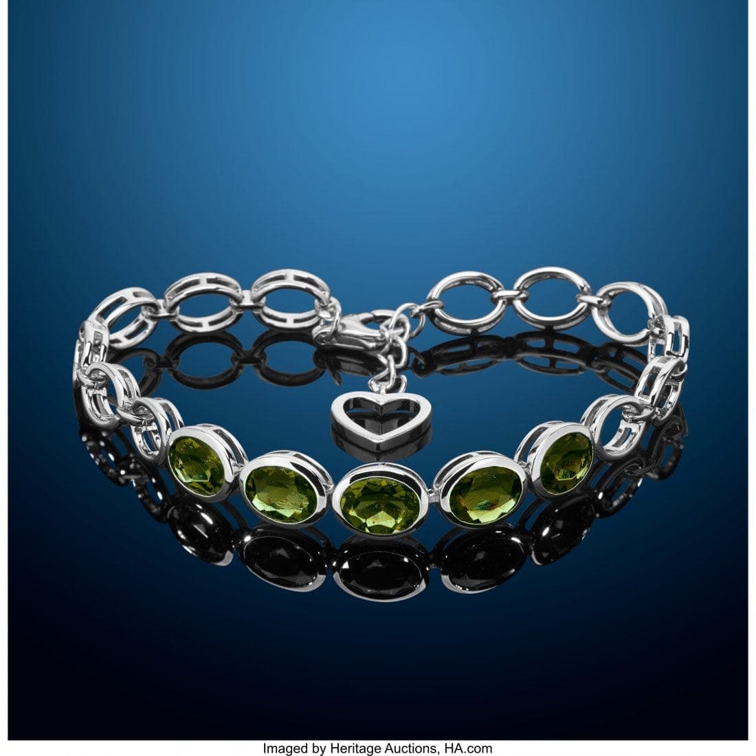 oval-cut moldavites in a bracelet