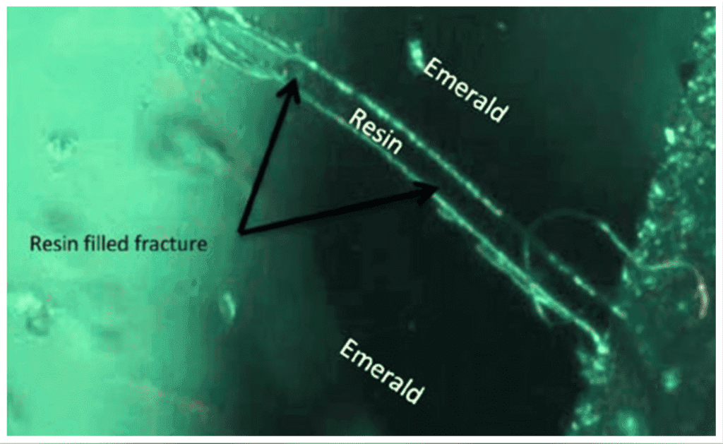 surface reaching fissure in resin-filled emerald