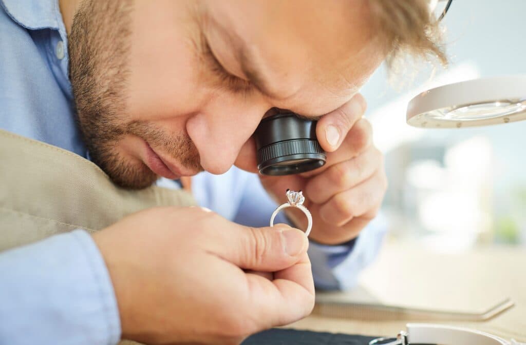 Man evaluating a gemstone
