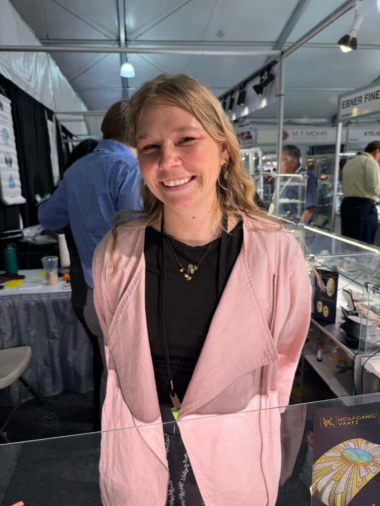 Katja Vaatz is wearing a necklace and earrings