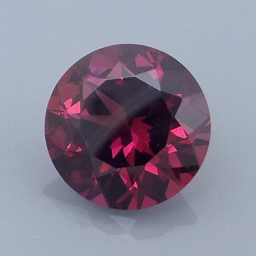 Finished version of Fancy 10-Sided Round Brilliant Cut Rhodolite Garnet