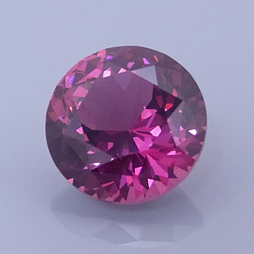 Finished version of Fancy Portuguese Brilliant Cut Rhodolite Garnet