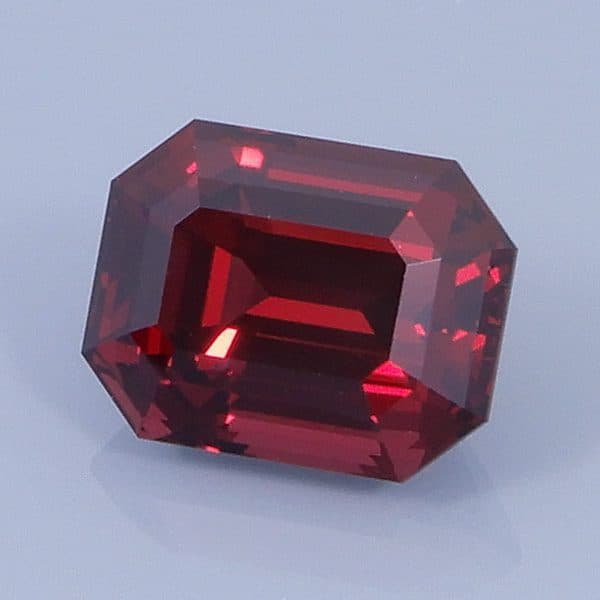 Finished version of Emerald Cut Rhodolite Garnet