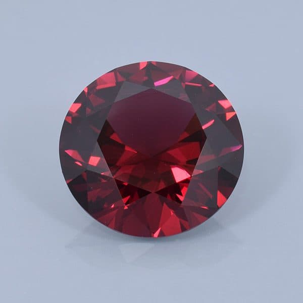 Finished version of Round Brillliant Cut Rhodolite Garnet