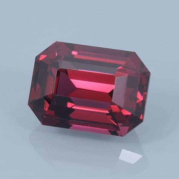 Finished version of Emerald Cut Rhodolite Garnet