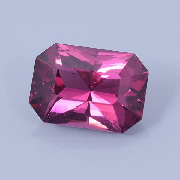 Finished version of Radiant Step Emerald Cut Rhodolite Garnet