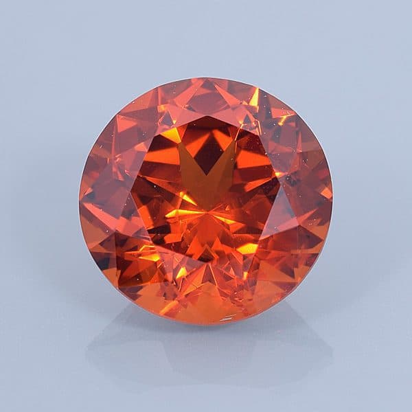 Finished version of Fancy Round Brilliant Cut Spessartite Garnet
