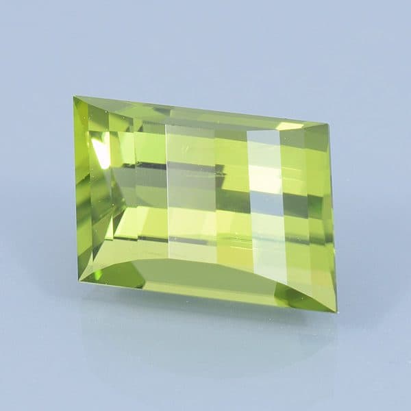 Finished version of Opposed Bar Rhombus Cut Peridot