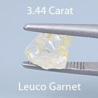 Rough version of Radiant Step Keystone Cut Grossular Garnet