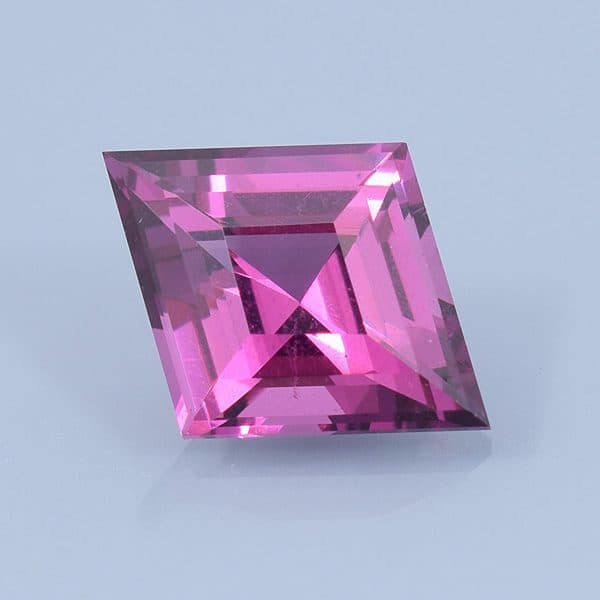 Finished version of Step Cut Diamond Cut Rhodolite Garnet