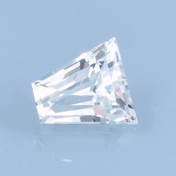 Finished version of Keystone or Short Tapered Baguette Cut Leuco Grossular Garnet