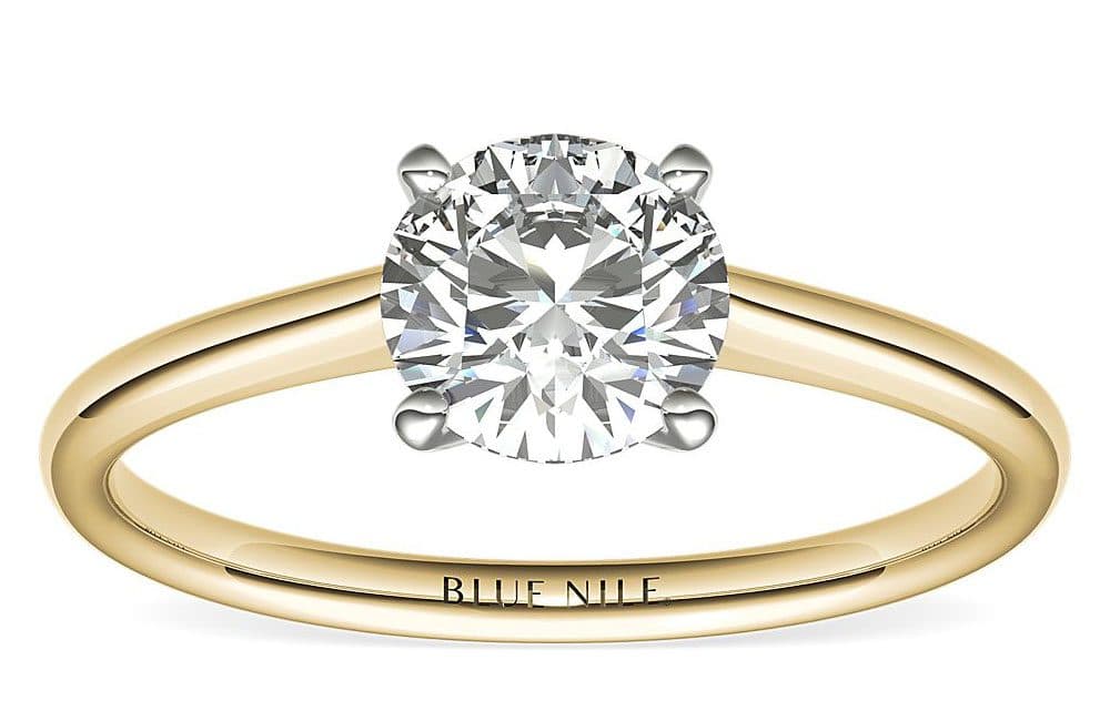 yellow gold ring with petite solitaire - most popular diamond shapes