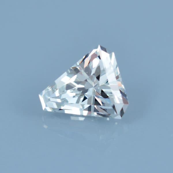 Finished version of Custom Elongated Triangle Cut Leuco Grossular Garnet