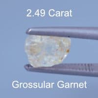Rough version of Custom Elongated Triangle Cut Leuco Grossular Garnet