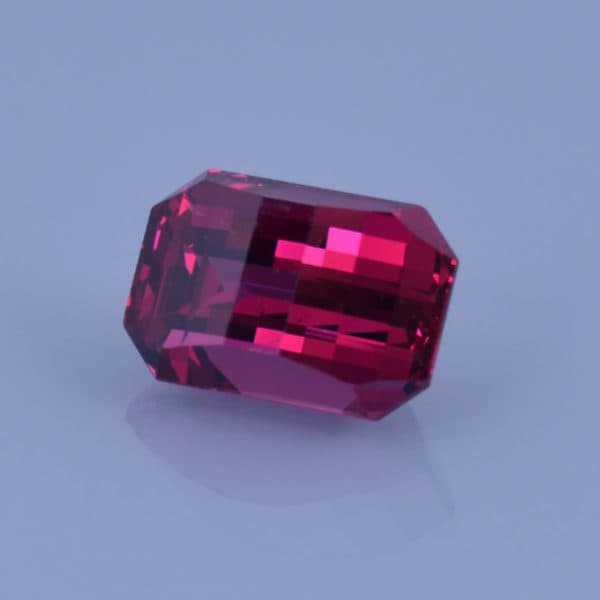 Finished version of Opposed Bar Emerald Cut Rhodolite Garnet
