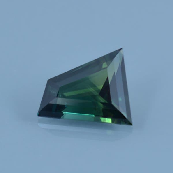 Finished version of Step Cut Horsehead Shape Cut Sapphire