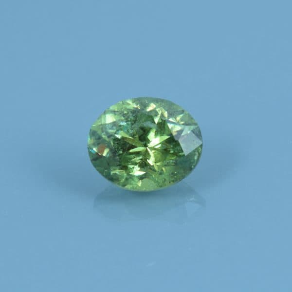 Finished version of Custom Brilliant Oval Cut Demantoid Garnet