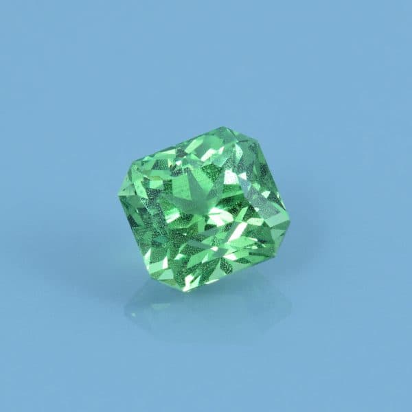 Finished version of Custom Short Brilliant Emerald Cut Tsavorite Grossular Garnet