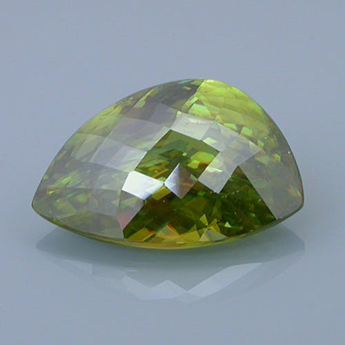 sphene 19 before - repaired and recut gems