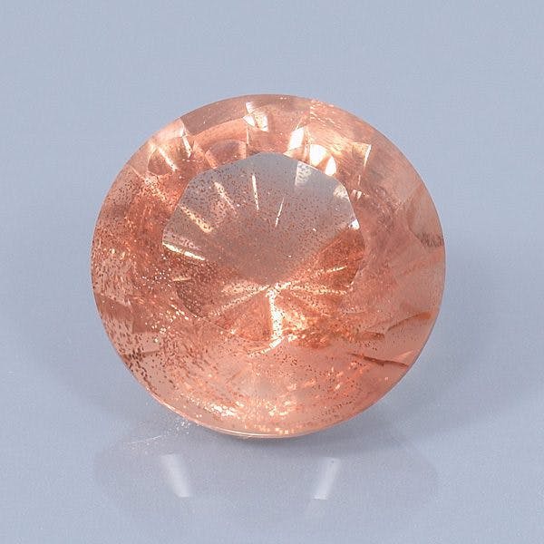 Finished version of Fancy Curved Facet Round Cut Sunstone