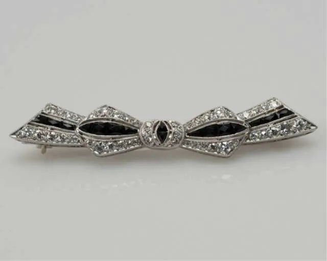 Art Deco onyx and diamond platinum brooch