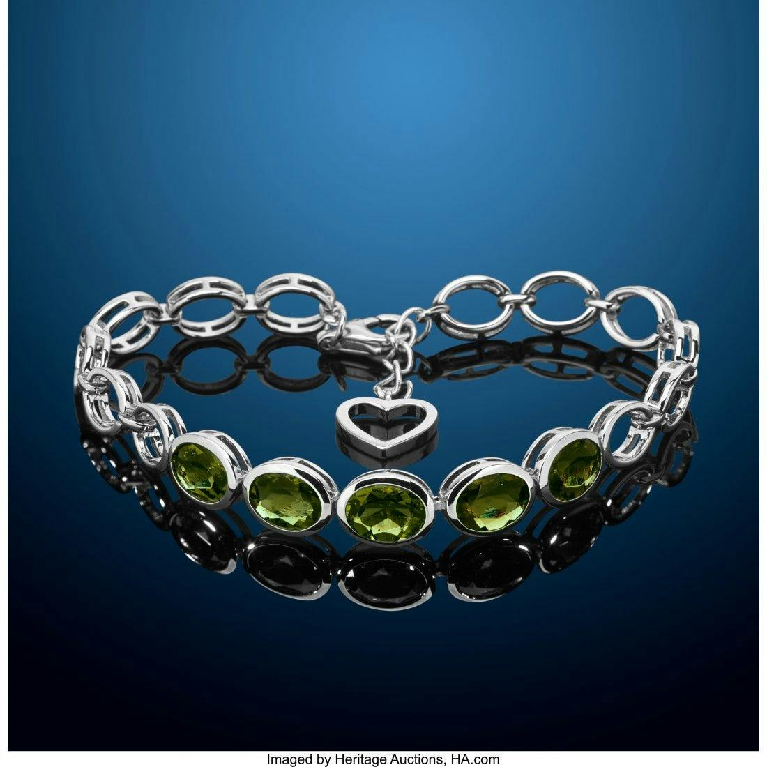 oval-cut moldavites in a bracelet