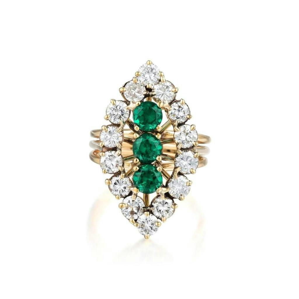 gold ring with diamonds and synthetic emeralds