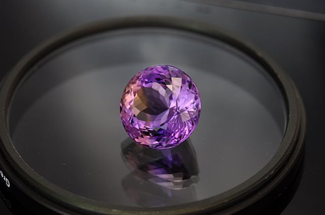 handling gems securely - ametrine round cut