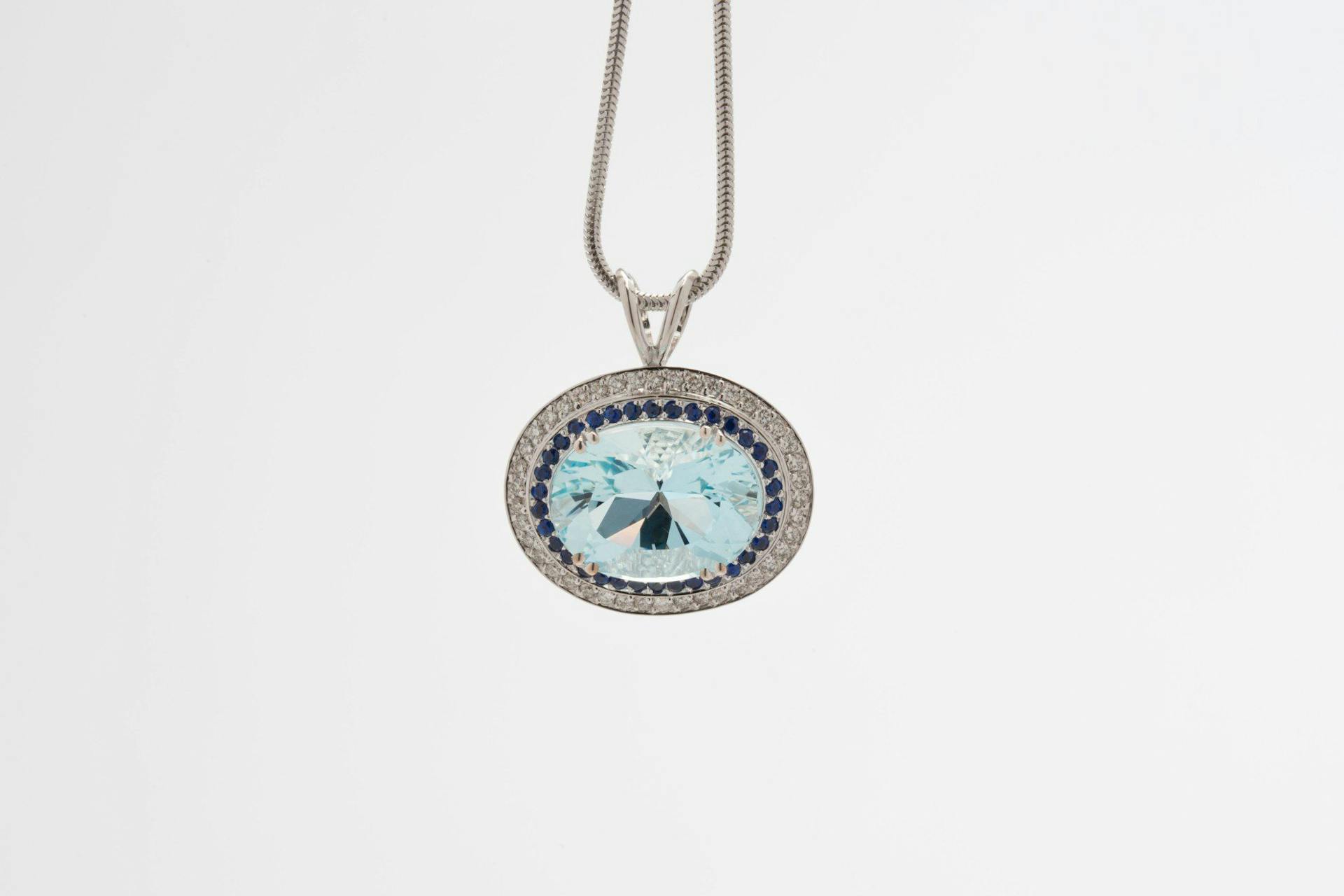 recut aquamarine pendant - repaired and recut gems