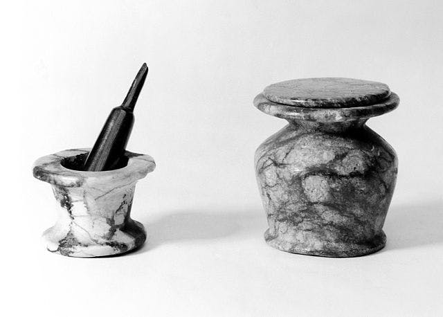 Ancient Egyptian kohl pot and pestle