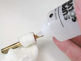 Applying a drop of solvent to glue joint