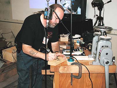 Marks being cut in the layers of metal