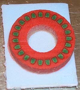 Green wax ring being made