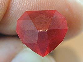 All crown facets are cut in - heart ruby