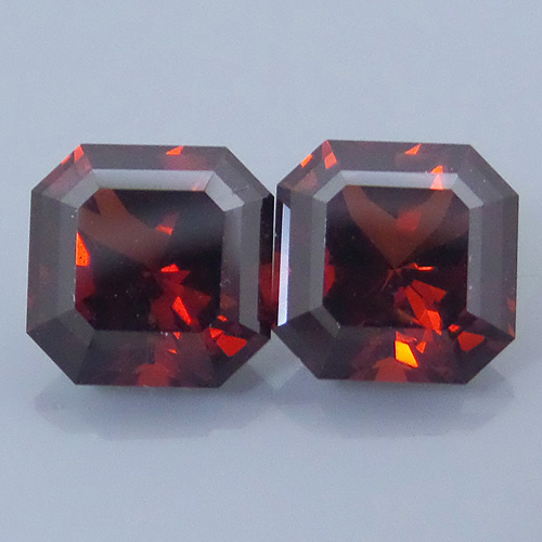 Finished version of Square Barion Cut Malaya Garnet Pair