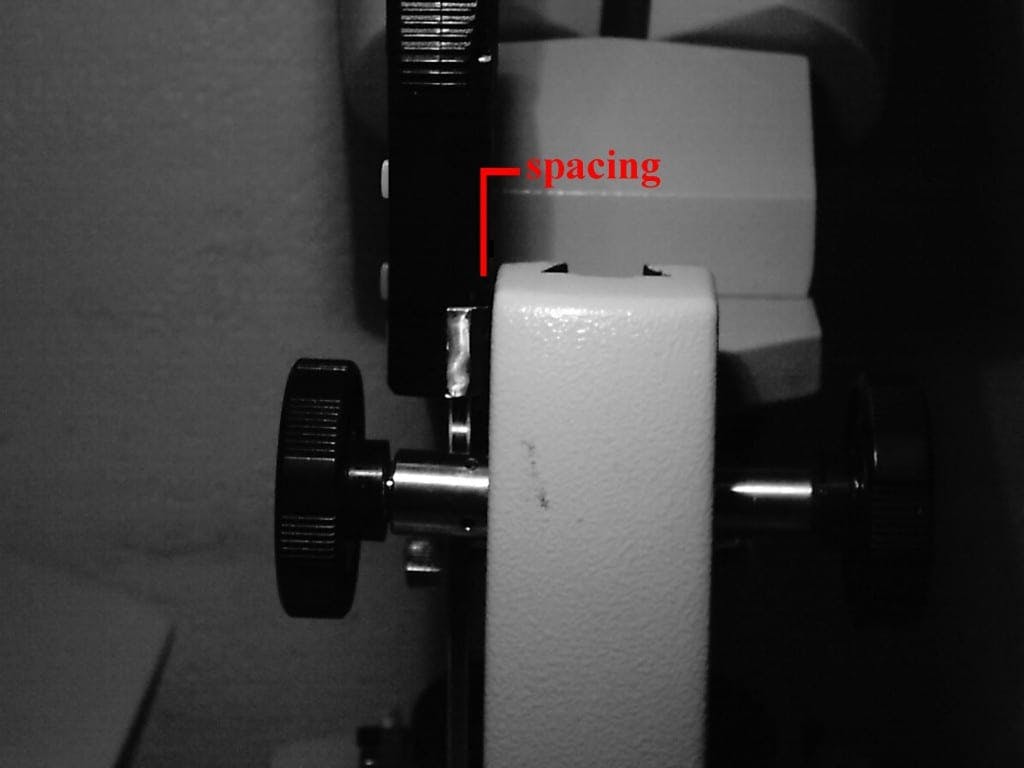 space between caliper and microscope