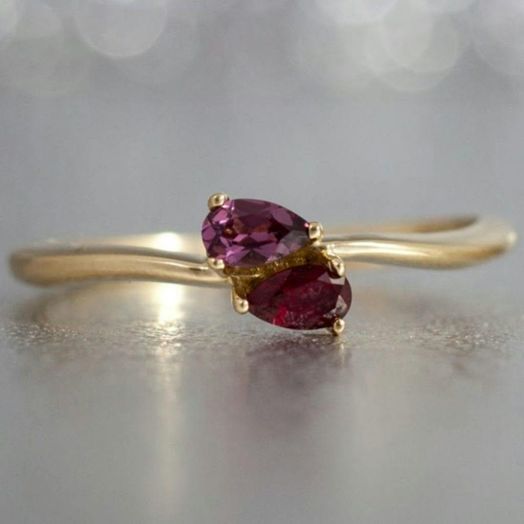 toi et moi rhodolite and ruby engagement ring