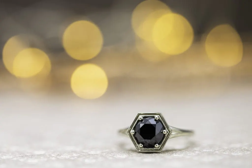 black diamond in hexagon setting engagement ring