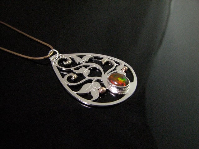 A Cabochon Bezel Setting For Unusual Opal Doublets