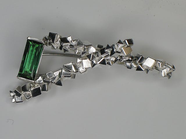 silver brooch with tourmaline
