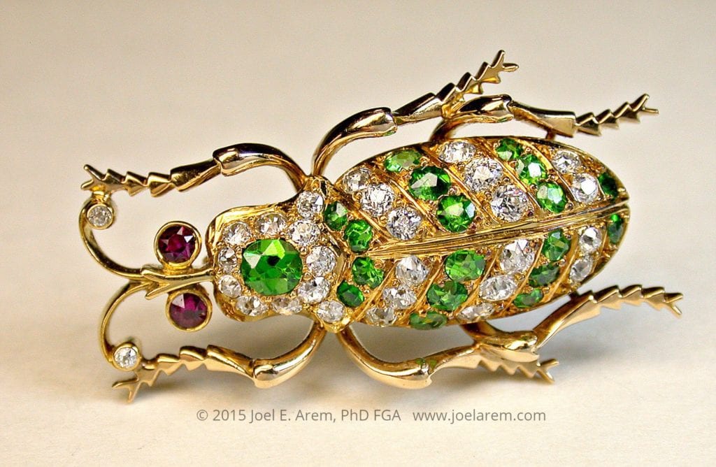 Antique beetle pin - demantoids. red garnets, and diamonds