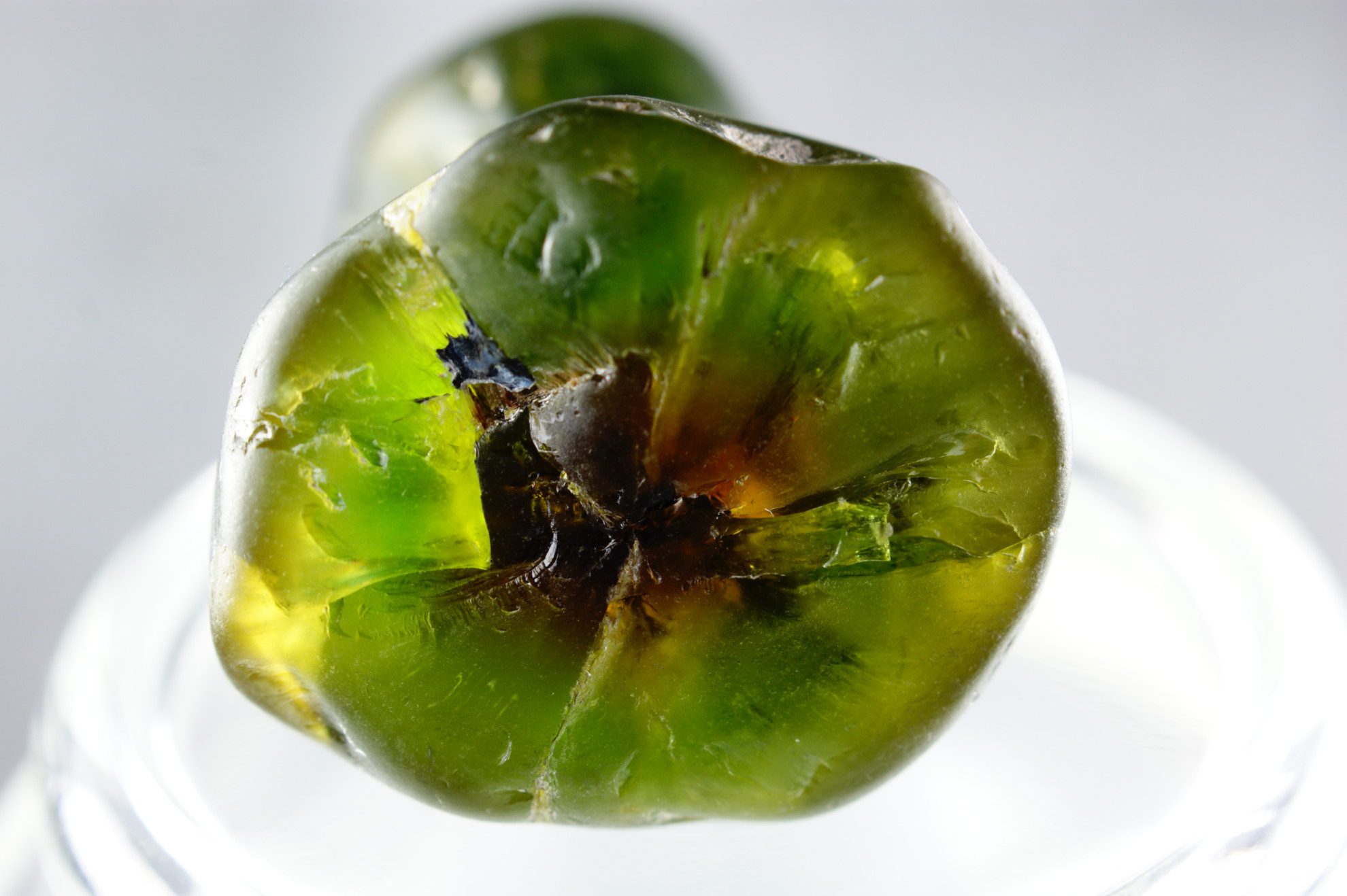 demantoid garnet buying guide - 76 carat color zoned rough