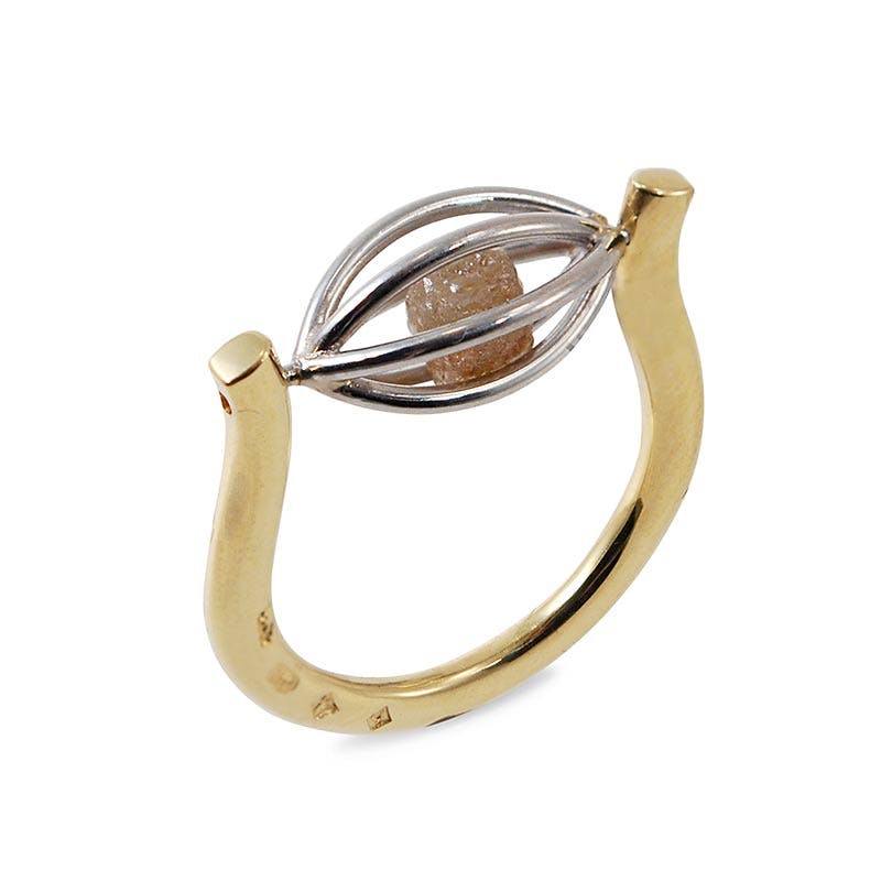 raw stone jewelry design and care - tension cage ring