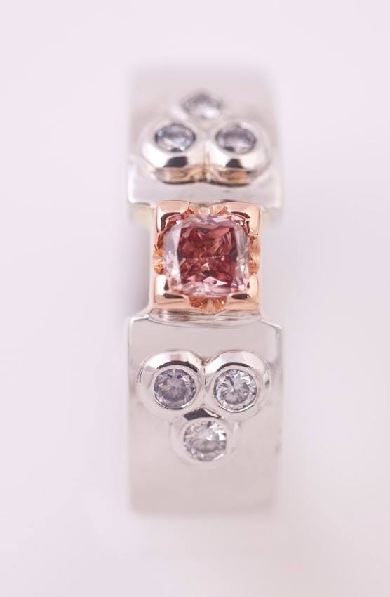 fancy colored pink diamond buying guide - 0.18ct fancy deep orangy pink with fancy light blue accents