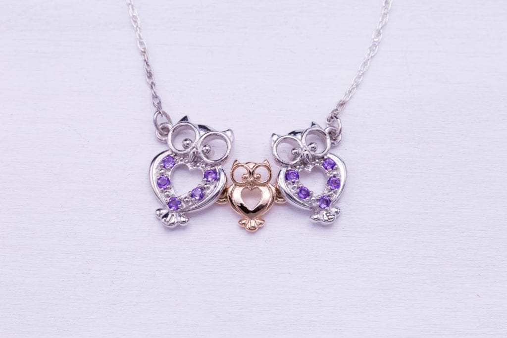 amethysts in an owl motif pendant