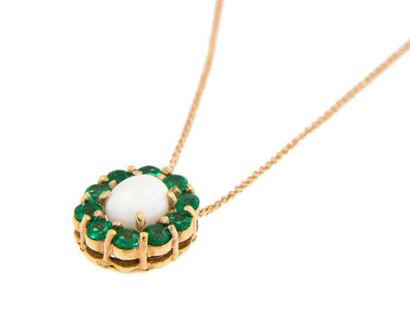 conch pearl buying guide - white conch pearl and emerald pendant