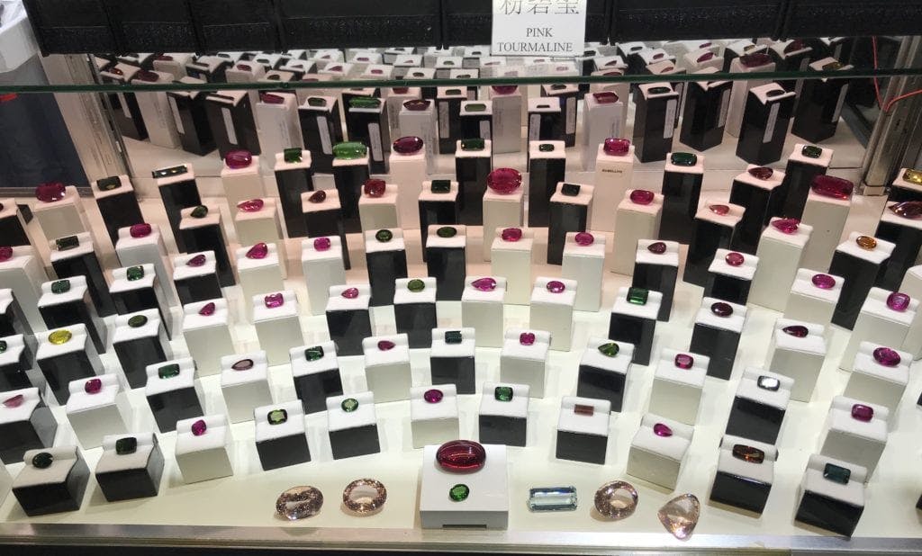 Tucson display of tourmalines - diamond cost
