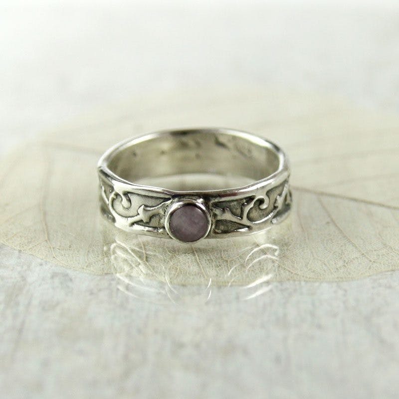 victorian-style ring with bezel-set amethyst - protective gem settings