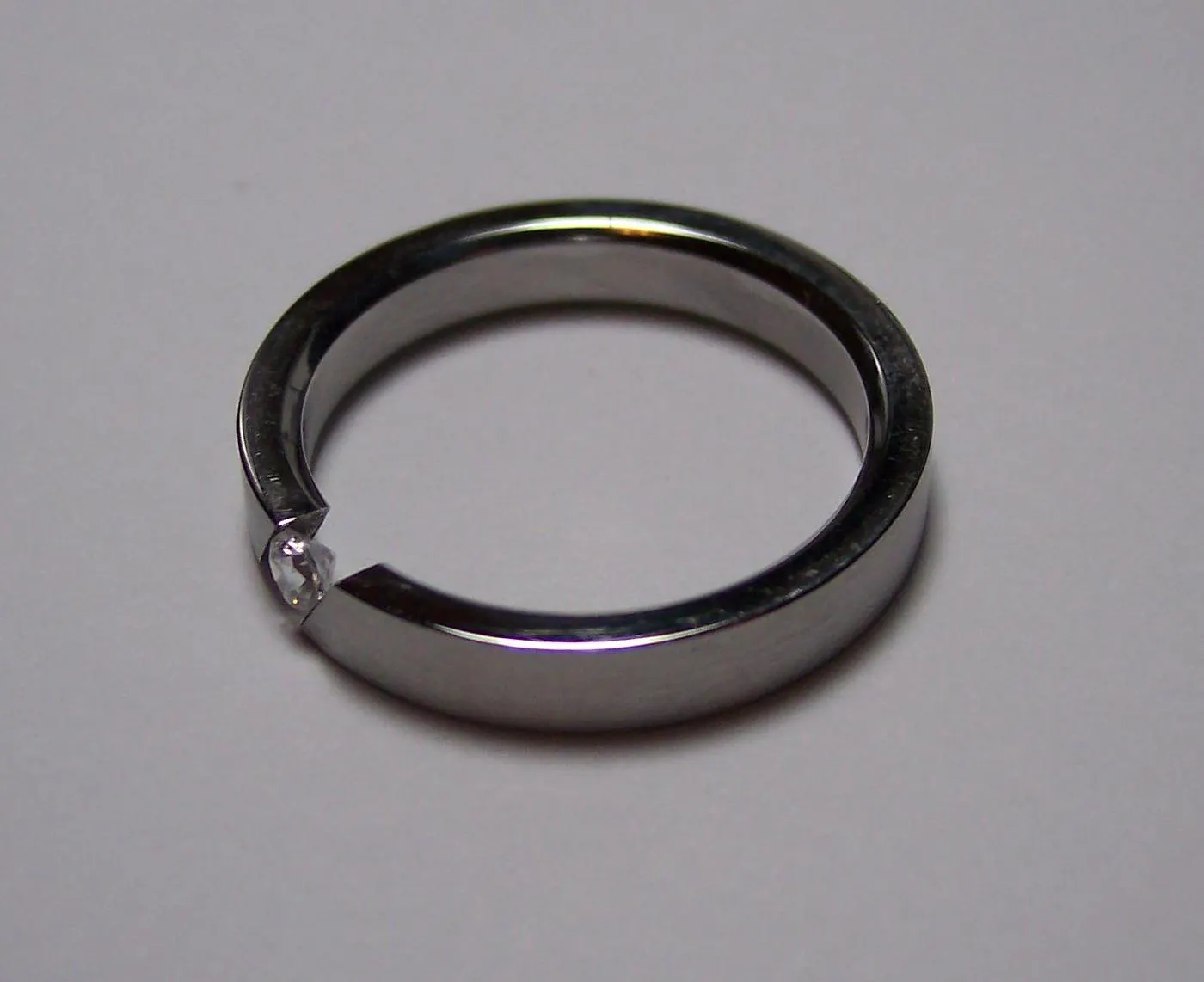 tension-set diamond ring - protective gem settings