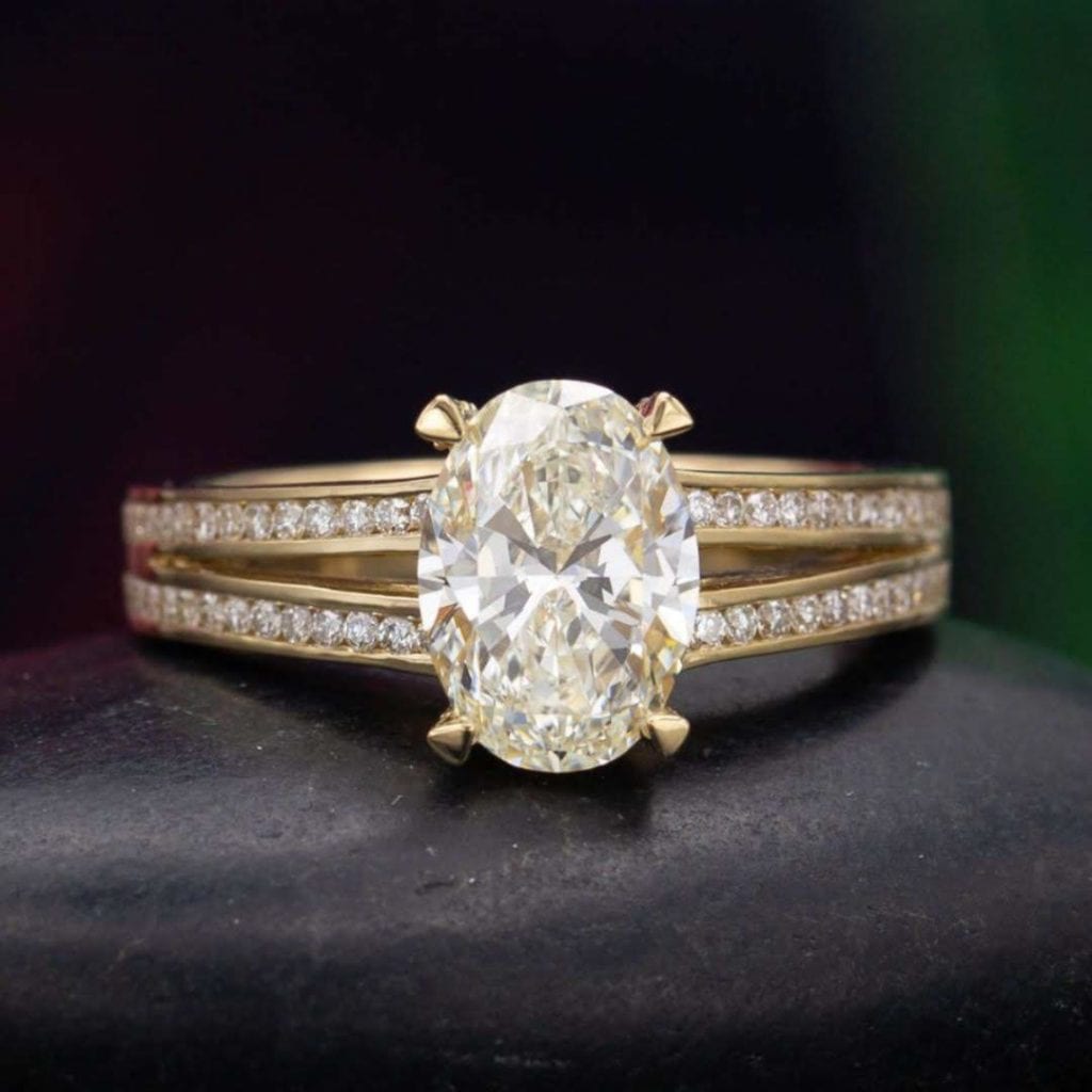 diamond shape - oval diamond set in a split shank engagement ring